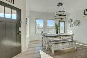 Dining area with light wood-type flooring and a wealth of natural light