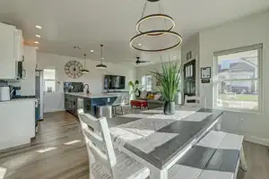 Dining room featuring ceiling fan, light hardwood / wood-style floors, and sink