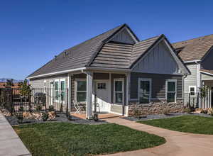 View of front of property with a front yard