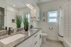 Full bathroom featuring tile patterned flooring, shower / tub combo, vanity, and toilet