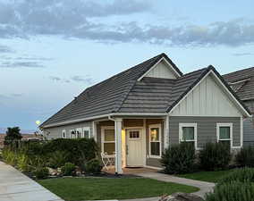 View of front of property with a front lawn