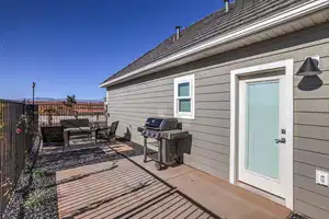 View of patio with area for grilling and an outdoor hangout area