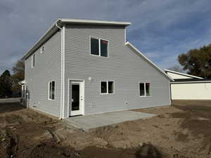 Rear view of property with a patio area