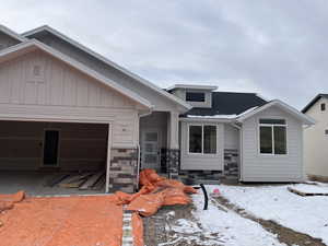 View of front of home featuring a garage