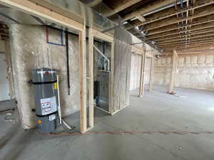 Basement featuring secured water heater