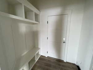 Mudroom with dark hardwood / wood-style floors