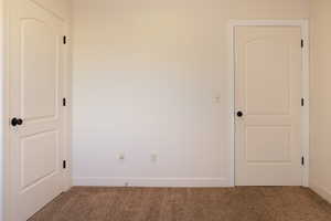 View of carpeted spare room