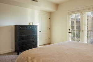 Unfurnished bedroom with light carpet