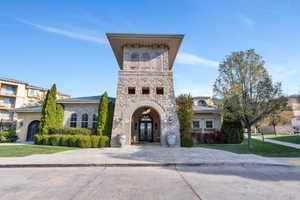 View of front facade with a front lawn and french doors