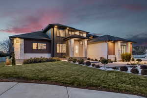 Prairie-style house with a lawn