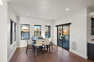 Dining space featuring dark hardwood / wood-style flooring