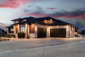 Prairie-style home with a garage