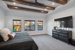 Carpeted bedroom with beamed ceiling