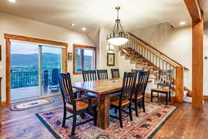 Dining space with a mountain view and dark hardwood / wood-style floors