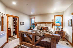 Bedroom with light colored carpet