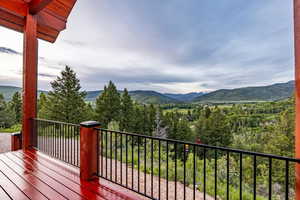 Wooden terrace featuring a mountain view