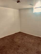 View of carpeted spare room