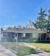 Ranch-style house featuring a front yard