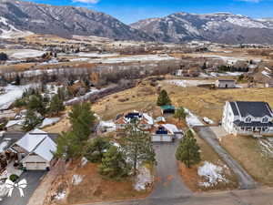 Snowy aerial view featuring a mountain view