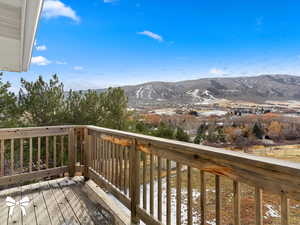 Wooden deck featuring a mountain view