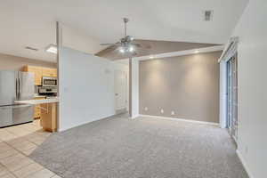 Bright Kitchen and Living Room With Vaulted Ceilings