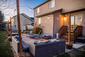 View of patio / terrace with an outdoor living space with a fire pit