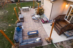 View of patio / terrace featuring an outdoor living space with a fire pit