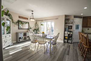 Dining room featuring dark wood-type flooring