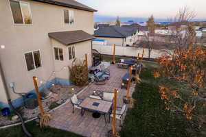 Patio terrace at dusk with outdoor lounge area