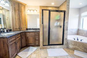 Bathroom with vanity and independent shower and bath