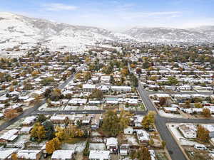 Snowy aerial view featuring a mountain view