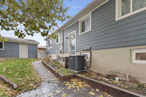 View of home's exterior with central AC unit