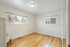 Spare room with light wood-type flooring