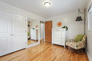 Sitting room featuring light hardwood / wood-style floors