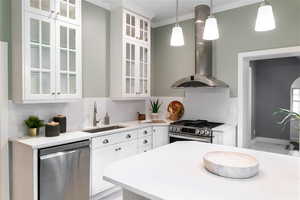 Kitchen featuring pendant lighting, white cabinets, new sink, appliances with stainless steel finishes, and island, gas range, wine fridge,  and new french door stainless fridge.  New dishwasher too!