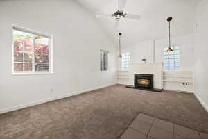 ADU - large living room with a fireplace, and a healthy amount of sunlight