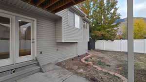 View of side of property with a mountain view