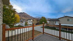 Wooden deck featuring a mountain view