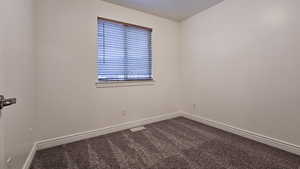 Empty room with carpet flooring