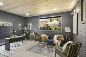 Carpeted home office with wood ceiling