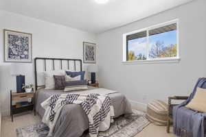 Bedroom featuring carpet flooring and a textured ceiling