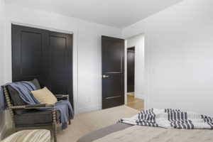 Bedroom with a closet and light wood-type flooring