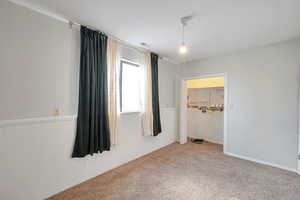 Empty room featuring carpet flooring