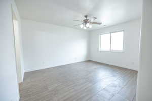 Master Bedroom with tile floors walk in closet and master bath