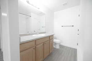 Master Bathroom featuring tile flooring, vanity, and toilet