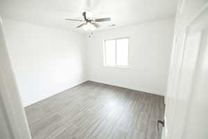 Unfurnished room with tile flooring and ceiling fan