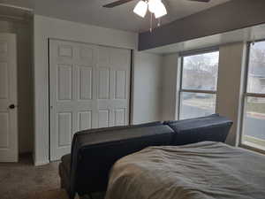 2nd Bedroom up with ceiling fan, a closet, carpet, and a textured ceiling