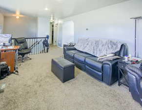 Nice size living room with view towards stairs, dining and hall