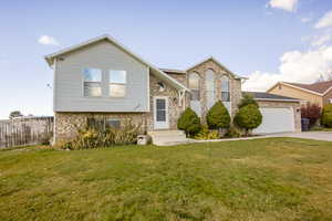 View of front of corner lot home featuring a 2 car garage and RV parking