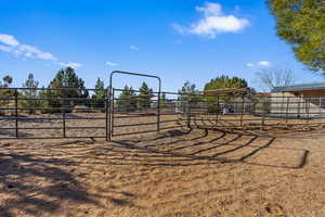 Exterior space with a rural view and an outdoor structure